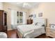 Bedroom with a ceiling fan, wood floors, dresser and natural light at 1990 Appalachee Cir, Tavares, FL 32778