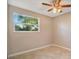 Bedroom featuring tile floors, a ceiling fan, and a bright window at 210 Cadillac Ct, Altamonte Springs, FL 32701