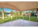 Relaxing screened patio overlooking the lush backyard and mature trees at 210 Cadillac Ct, Altamonte Springs, FL 32701