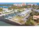 Aerial view of condos with a private boat dock along the intercostal waterway and nearby beaches at 2100 N Peninsula Ave # 1020, New Smyrna Beach, FL 32169