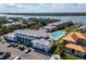 Aerial view of the condos, boat docks, and community pool with beautiful waterfront views at 2100 N Peninsula Ave # 1020, New Smyrna Beach, FL 32169