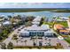 Overhead view of condominiums with ample parking, a pool, and nearby boat docks, perfect for waterfront living at 2100 N Peninsula Ave # 1020, New Smyrna Beach, FL 32169