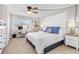 Cozy bedroom with a comfortable bed, ample natural light, and a dedicated workspace by the window at 2100 N Peninsula Ave # 1020, New Smyrna Beach, FL 32169