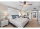 Comfortable bedroom with ceiling fan, lamps, and closet at 2100 N Peninsula Ave # 1020, New Smyrna Beach, FL 32169