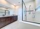 Bathroom with glass-enclosed shower and granite countertop at 2687 Chantilly Ave, Kissimmee, FL 34741