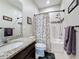 Bathroom featuring tiled shower and granite vanity at 2687 Chantilly Ave, Kissimmee, FL 34741