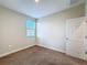 Bright bedroom with neutral walls, carpet floor, and a window for natural light at 2687 Chantilly Ave, Kissimmee, FL 34741