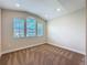 Comfortable bedroom with three windows, neutral carpeting, and natural light at 2687 Chantilly Ave, Kissimmee, FL 34741