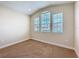 Bright bedroom with three windows, neutral carpeting, providing plenty of sunlight at 2687 Chantilly Ave, Kissimmee, FL 34741