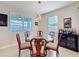 Dining area with a glass table and view of the backyard at 2687 Chantilly Ave, Kissimmee, FL 34741