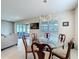 Cozy dining area with glass table, seating for six, and view of the backyard at 2687 Chantilly Ave, Kissimmee, FL 34741