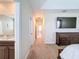 Hallway with a view of the bathroom and bedroom, showcasing the home's layout at 2687 Chantilly Ave, Kissimmee, FL 34741