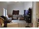 View of the living room featuring tile floors, media center, sofa, and large window at 274 W 20Th St, Apopka, FL 32703