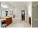 Bright bathroom featuring a soaking tub and dual sink vanity at 2926 Falconhill Dr, Apopka, FL 32712