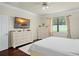 Bedroom featuring a flatscreen TV and large window at 2926 Falconhill Dr, Apopka, FL 32712