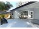 Inviting covered patio with chairs, lounge chairs, and outdoor seating area at 297 N Lake Jessup Ave, Oviedo, FL 32765