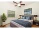 Comfortable bedroom featuring a ceiling fan, large bed, and ample natural light at 297 N Lake Jessup Ave, Oviedo, FL 32765