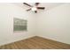 Neutral bedroom with ceiling fan and light hardwood flooring at 297 N Lake Jessup Ave, Oviedo, FL 32765