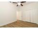 An empty bedroom featuring light hardwood flooring and a ceiling fan at 297 N Lake Jessup Ave, Oviedo, FL 32765