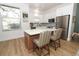 Bright kitchen featuring a large island, stainless steel appliances, and white cabinetry at 297 N Lake Jessup Ave, Oviedo, FL 32765