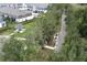 Aerial view of the community's amenities: a gazebo, a walking path, and manicured landscaping at 3031 Pilot House Pl, Oviedo, FL 32765