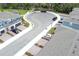 An aerial view of a parking area in the townhome community and adjacent homes at 3031 Pilot House Pl, Oviedo, FL 32765