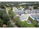 View of townhomes, community area with a gazebo, sidewalks, and mature trees in a residential neighborhood at 3031 Pilot House Pl, Oviedo, FL 32765