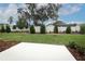 A well manicured backyard with an installed patio, healthy green grass and a privacy fence at 3031 Pilot House Pl, Oviedo, FL 32765