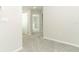 Hallway featuring neutral walls and carpets, and white trim throughout at 3031 Pilot House Pl, Oviedo, FL 32765