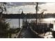 Picturesque waterfront dock and gazebo offer tranquil views and serene lakeside enjoyment for relaxation at 3307 Greenwich Village Blvd # 205, Orlando, FL 32835