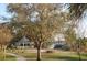 Idyllic gazebo on lush green lawn offers a serene and picturesque outdoor retreat surrounded by mature trees at 3307 Greenwich Village Blvd # 205, Orlando, FL 32835