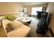 This living room features carpeted floors, a white sofa, and plenty of space for relaxation at 3307 Greenwich Village Blvd # 205, Orlando, FL 32835