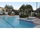 Community pool with hot tub, gazebo, and lounge chairs at 3307 Greenwich Village Blvd # 205, Orlando, FL 32835