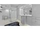 Elegant bathroom featuring a glass shower, marble accents and updated vanity at 400 E Colonial Dr # 1607, Orlando, FL 32803