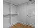 Walk-in closet with custom shelving and door at 400 E Colonial Dr # 1607, Orlando, FL 32803