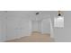 Hallway featuring a bright area with three doors and wood flooring at 400 E Colonial Dr # 1607, Orlando, FL 32803