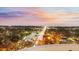 Elevated view of city lights under a colorful sunset sky, showcasing the property's prime location at 400 E Colonial Dr # 1607, Orlando, FL 32803