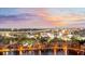 Capture the vibrant cityscape at night with glittering lights reflecting on the tranquil lake at 400 E Colonial Dr # 1607, Orlando, FL 32803