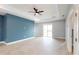 Spacious primary bedroom with tray ceiling and a large walk-in closet at 400 Miami Way, Poinciana, FL 34759