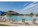 Community pool area featuring a large pool, lounge chairs, and a splash zone for  at 400 Miami Way, Poinciana, FL 34759