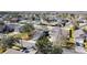 Tranquil aerial shot of a residential neighborhood with mature trees and community pond at 4012 Longworth Loop, Kissimmee, FL 34744