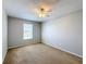 Bedroom featuring neutral walls, plush carpet, a window, and a ceiling fan with lights at 4012 Longworth Loop, Kissimmee, FL 34744