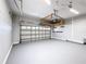 Clean and organized two-car garage with painted walls at 4012 Longworth Loop, Kissimmee, FL 34744