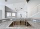 Close up of a modern kitchen sink and faucet with granite countertops and a view to the living area at 4012 Longworth Loop, Kissimmee, FL 34744