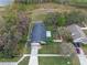 Aerial view of the home showcases lush landscaping and a spacious backyard at 4200 Bear Gully Rd, Winter Park, FL 32792