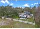 Aerial view of home with fenced yard and screened in porch at 4200 Bear Gully Rd, Winter Park, FL 32792