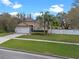 Charming single-Gathering home with a well-manicured lawn, mature landscaping, and a two-car garage at 4200 Bear Gully Rd, Winter Park, FL 32792