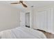 Bedroom featuring a ceiling fan and a closet with bi-fold doors at 4520 Lake Gem Cir, Orlando, FL 32806