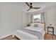 Bedroom with a wood-framed bed, ceiling fan, and neutral decor at 4520 Lake Gem Cir, Orlando, FL 32806