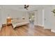 Spacious main bedroom includes wood flooring and an exterior view at 4520 Lake Gem Cir, Orlando, FL 32806